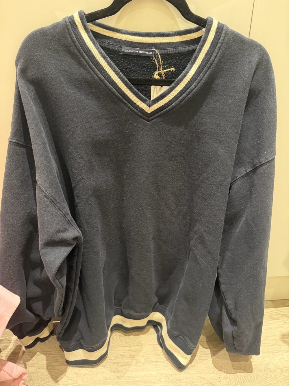 Brandy Melville Navy V‑Neck Sweater with Cream Trim